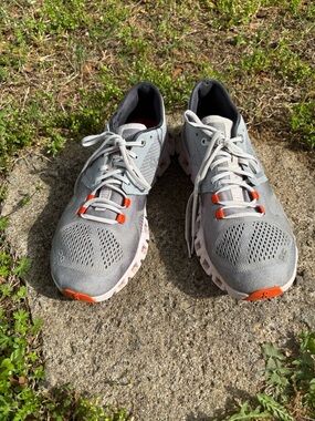 On Running Women's Light Gray Athletic Sneakers with Orange Accents
